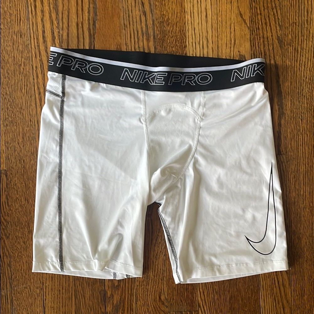 White NIKE PRO Compression Shorts.